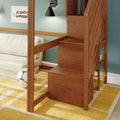 Wooden bunk bed with built-in staircase in kids' bedroom, teal wall, black wall sconce, yellow geometric rug and soccer ball