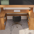 Natural wood loft bed with built-in desk and shelving, closed silver laptop, white headphones on stand, black swivel office chair and desk lamp on gray patterned rug