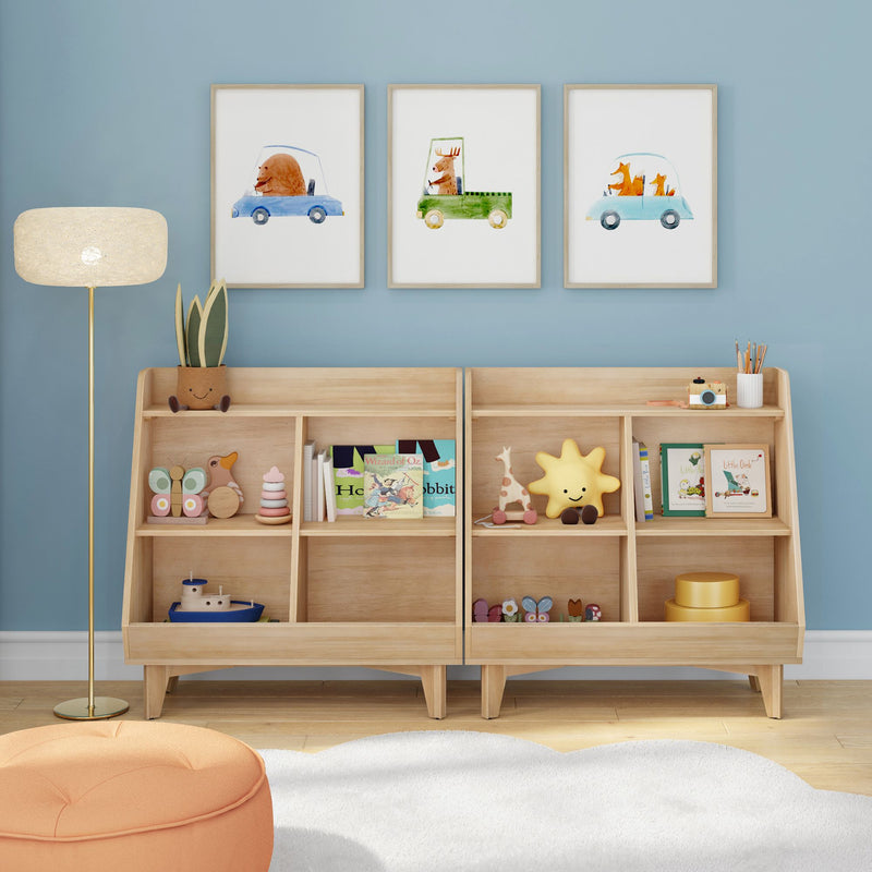 Children’s nursery with blue accent wall, three framed watercolor animal car prints above wooden toy storage shelves filled with plush toys and books