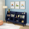 Kids room nursery with navy toy organizer bookcase, plush and wooden toys, white rug, floor lamp and framed animal car watercolor prints on blue wall