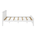 White painted wooden bed frame with vertical slatted headboard and wooden slat platform base for mattress support