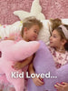 Various brightly decorated bedrooms with solid wood beds, bunk beds, and other bedroom furniture with families playing.
